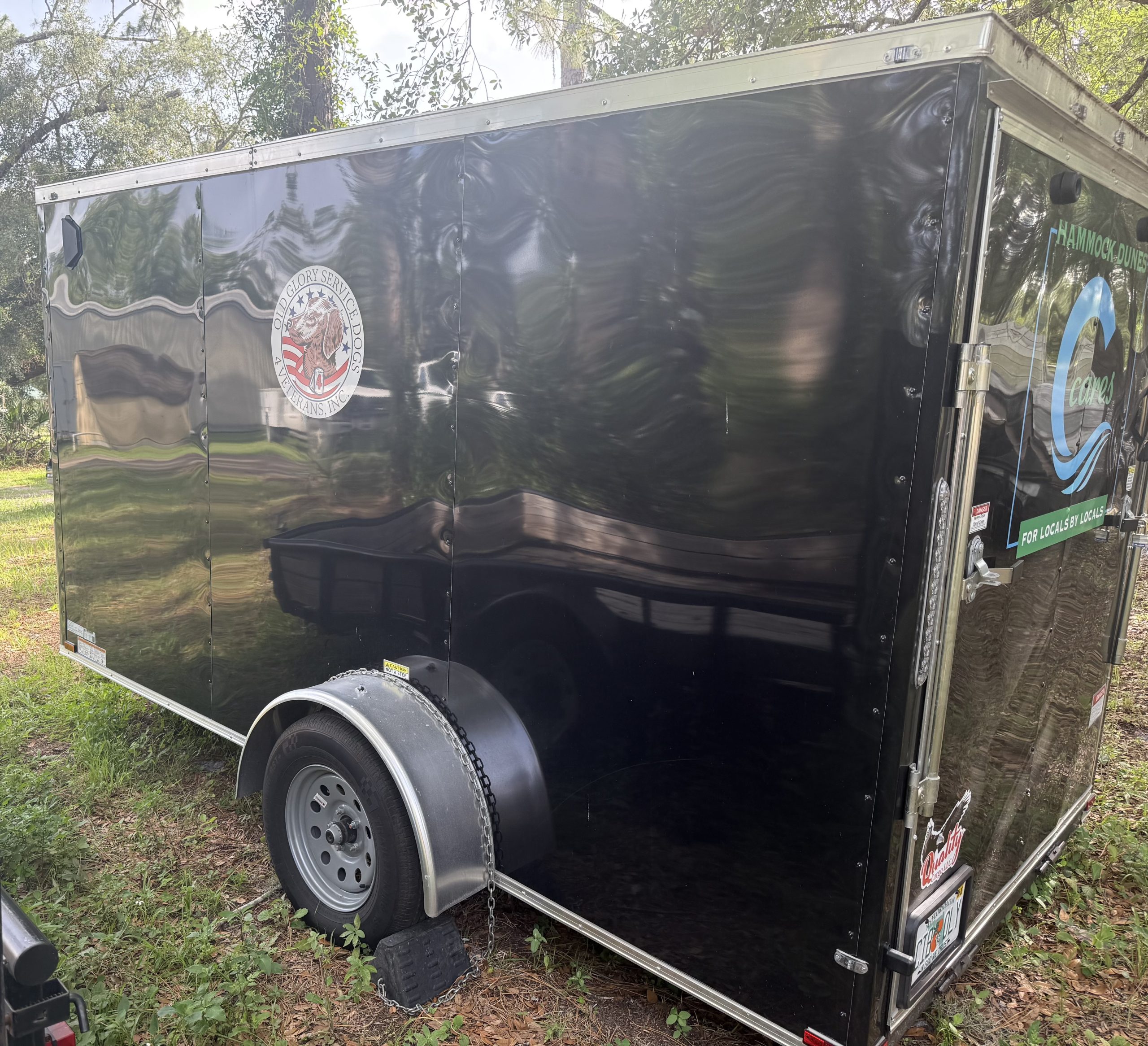 Old Glory Service Dogs trailer recognizing the support of Hammock Dunes Cares