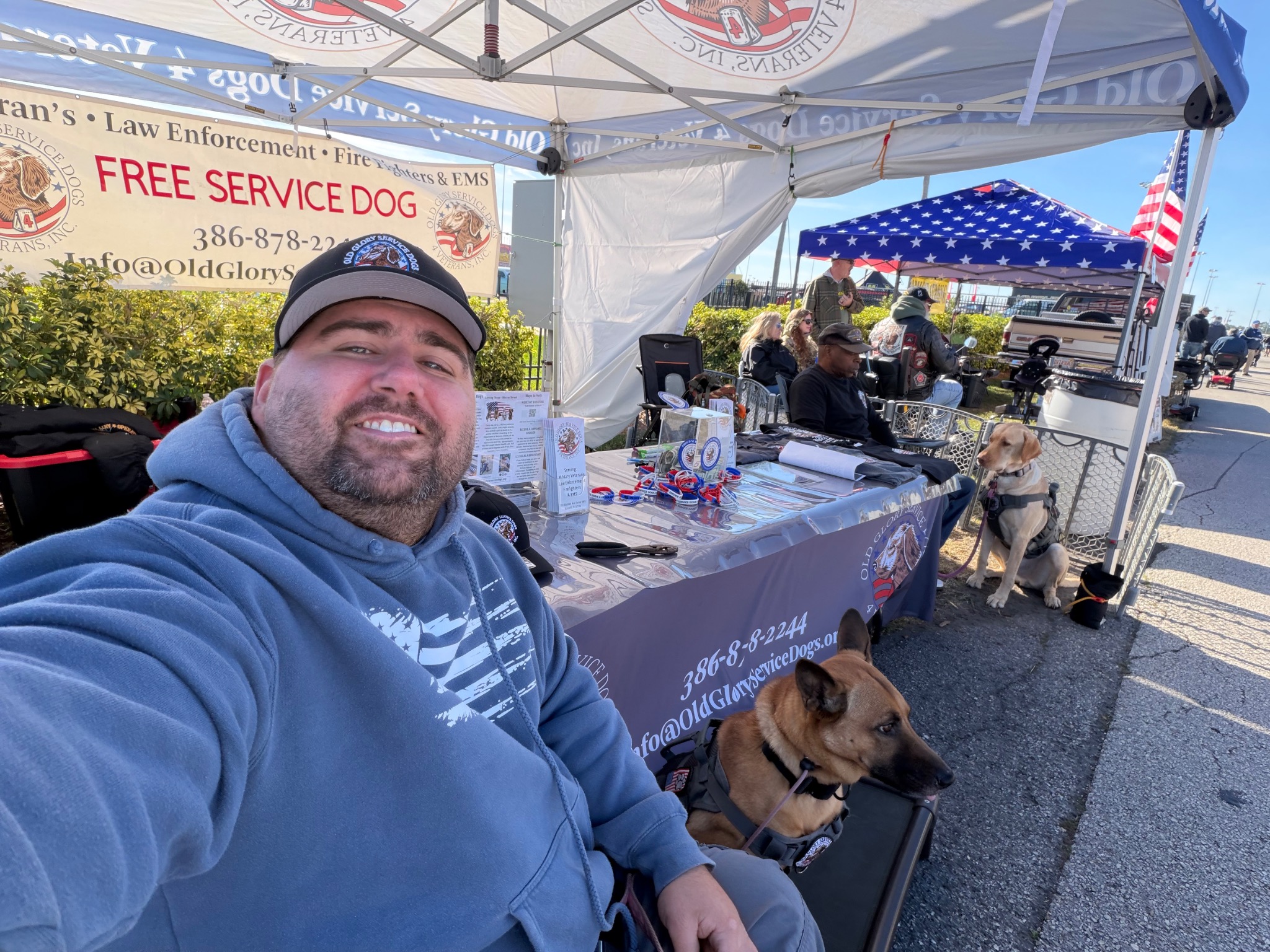 Old Glory members and service dogs participating in a community outreach event