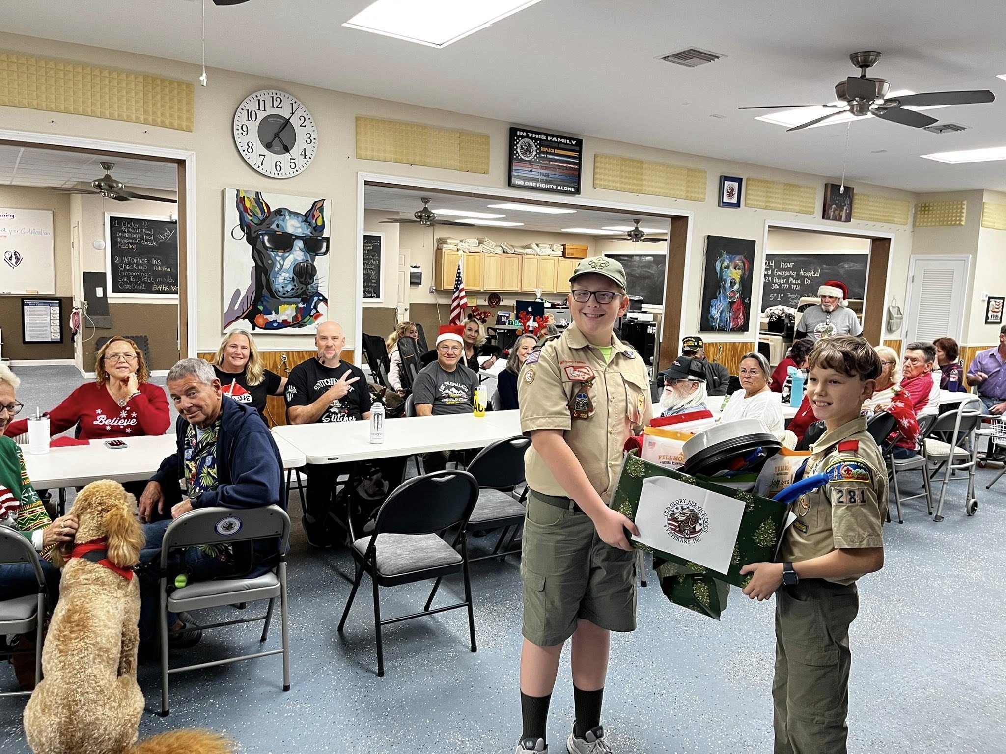 Old Glory members and service dogs participating in a community gathering with local Scouts"